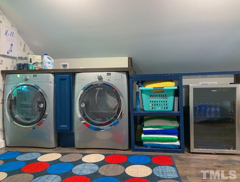 8709 Sleepy Creek Drive Raleigh, NC 27613 - Photo 24 of 28 Laundry room has Folding Table and area for hanging clothes