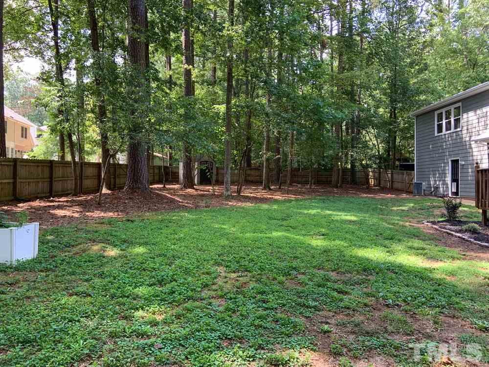 8709 Sleepy Creek Drive Raleigh, NC 27613 - Photo 28 of 28 HUGE Back yard fenced in and wooded for your privacy and outdoor pleasure