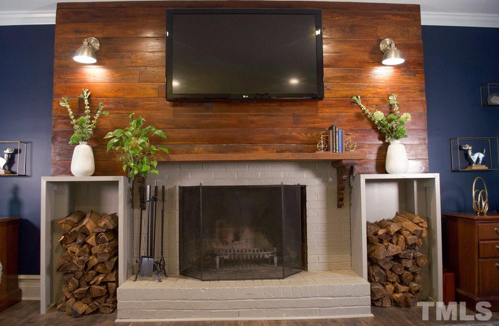 8709 Sleepy Creek Drive Raleigh, NC 27613 - Photo 9 of 28 Wood Burning Fireplace with Custom Surround wired for your Entertainment