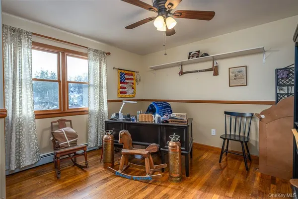 a bathroom with a granite countertop toilet sink and mirror
