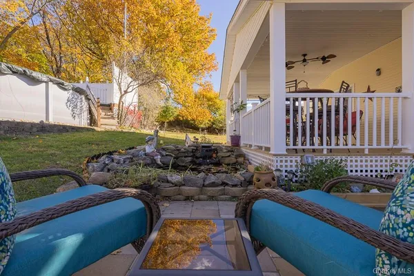a view of a backyard with wooden fence