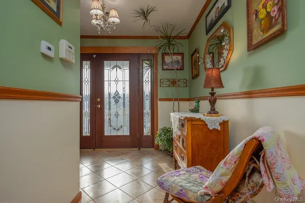 a living room with furniture a rug and a window