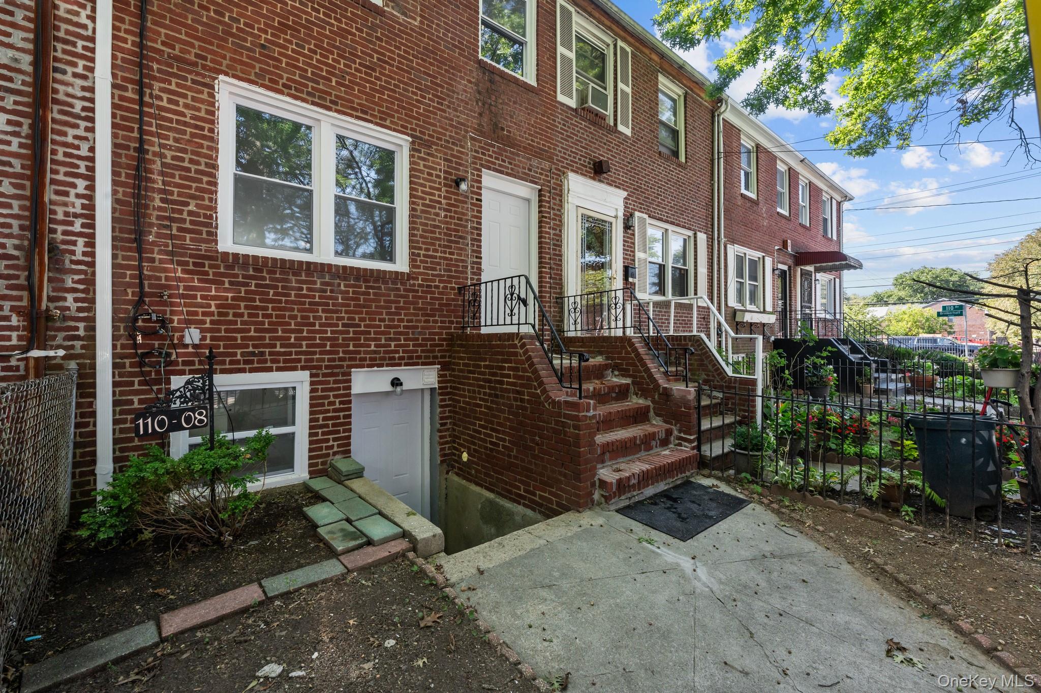 110-08 172nd Street Queens, NY 11433 - Photo 13 of 15 a view of a house with a yard