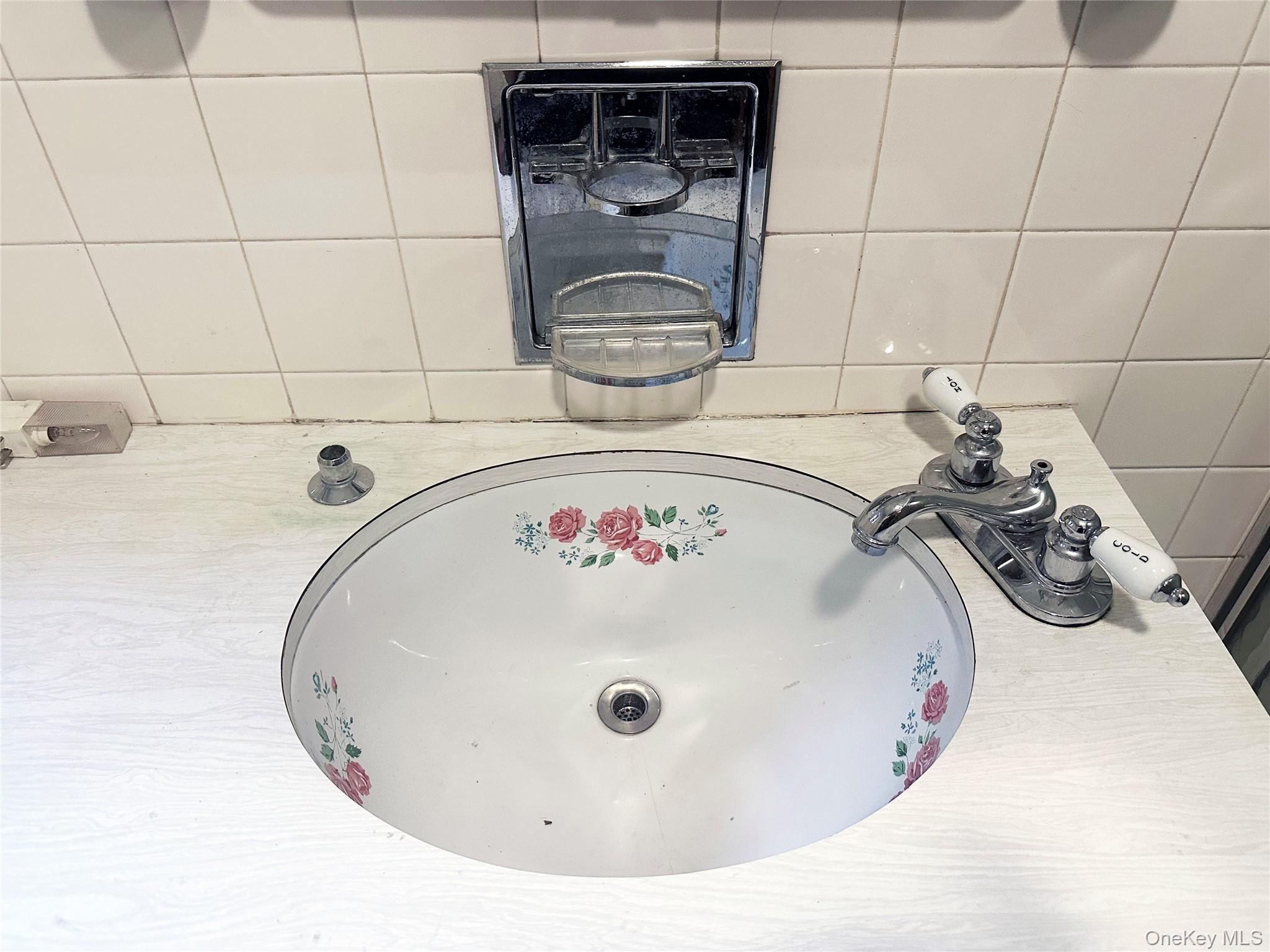 818 Methol Road Roscoe, NY 12776 - Photo 32 of 39 Vintage floral sink detail preserving the home’s original character and mid-century charm.