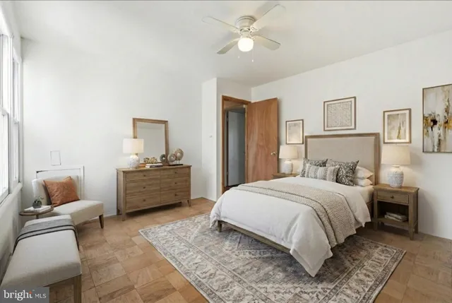 a bedroom with a bed and a couch