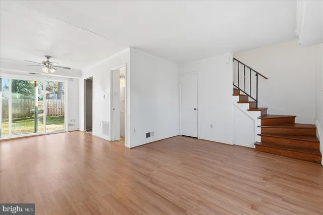 a view of an entryway with wooden floor