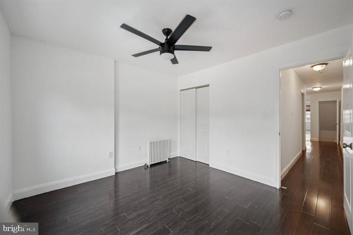 2467 79th Avenue, Unit 1 Philadelphia, PA 19150 - Photo 9 of 16 an empty room with wooden floor and a ceiling fan