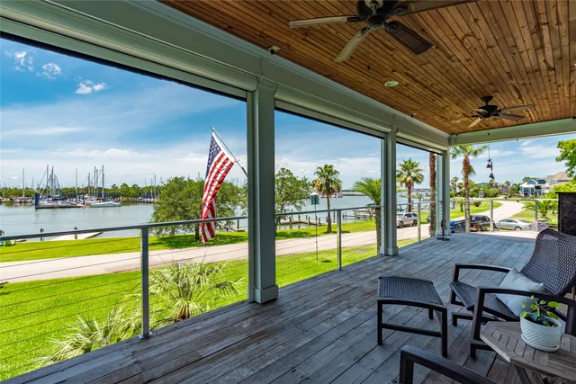 a view of a swimming pool with a table and chairs