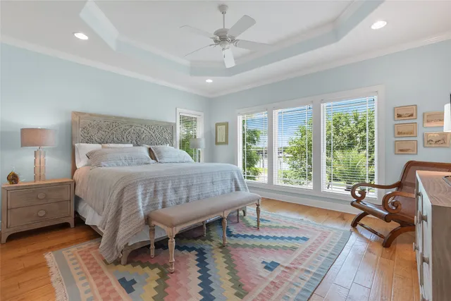 a bed room with a bed and a chair