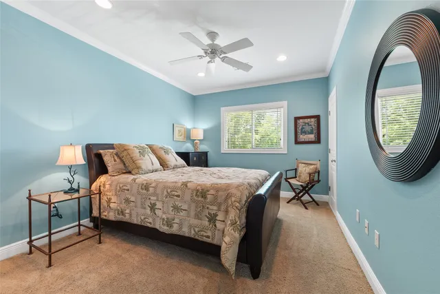 a bed room with a bed and a chair