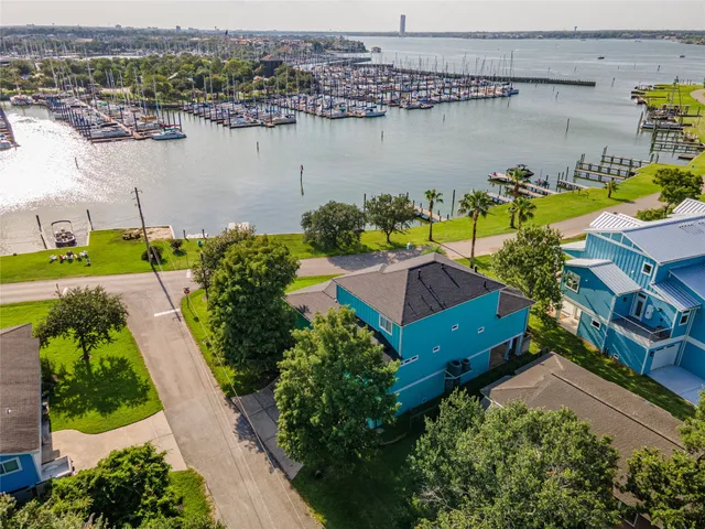 an aerial view of a house with a lake view