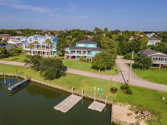 an aerial view of residential houses with outdoor space