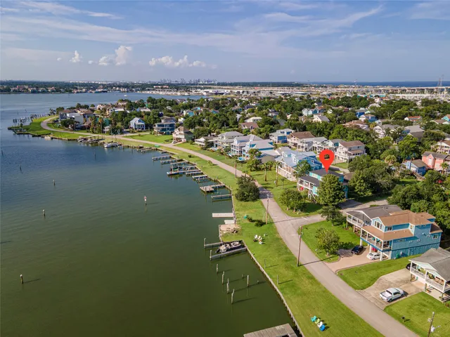 an aerial view of a house with a ocean view