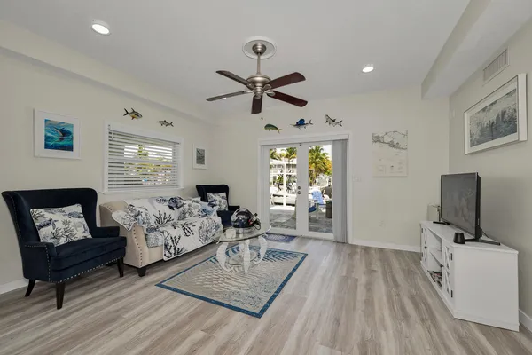 a bedroom with a large bed and a large window