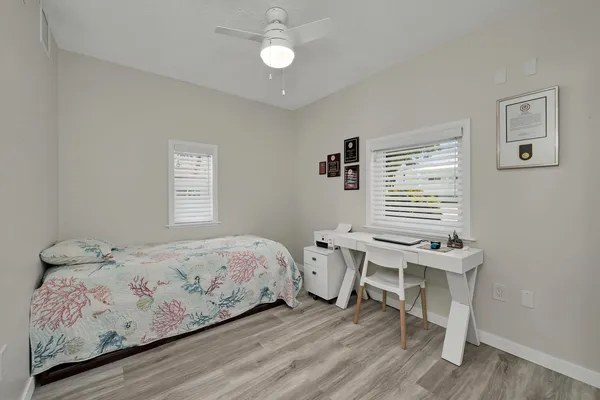 a front view of a house with a yard and a garage