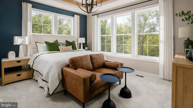 a bedroom with bed and a large window