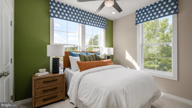 a bed room with a bed and a window