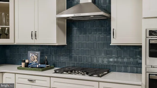 a kitchen with a stove and cabinets