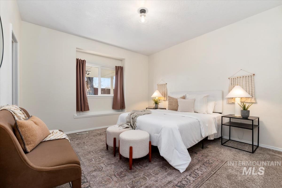 685 South Winthrop Way Boise, ID 83709 - Photo 23 of 46 Bedroom featuring carpet flooring and baseboards