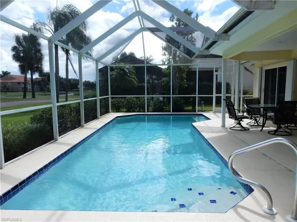 a view of a swimming pool with a patio
