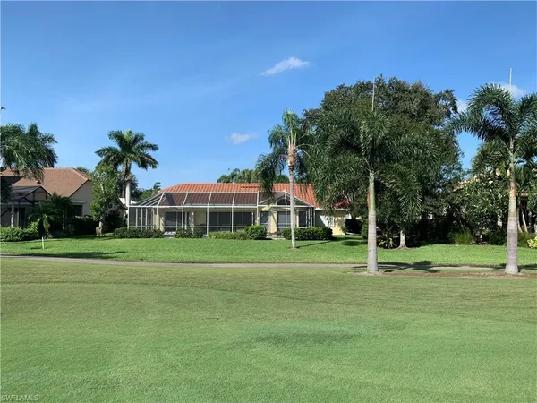 a front view of a house and a yard