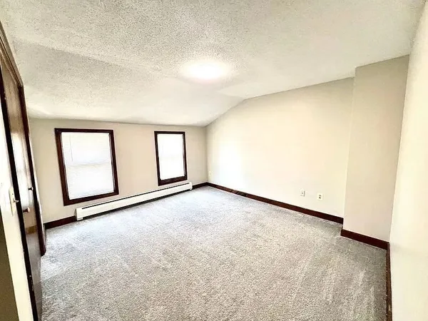a view of backyard with a deck and furniture