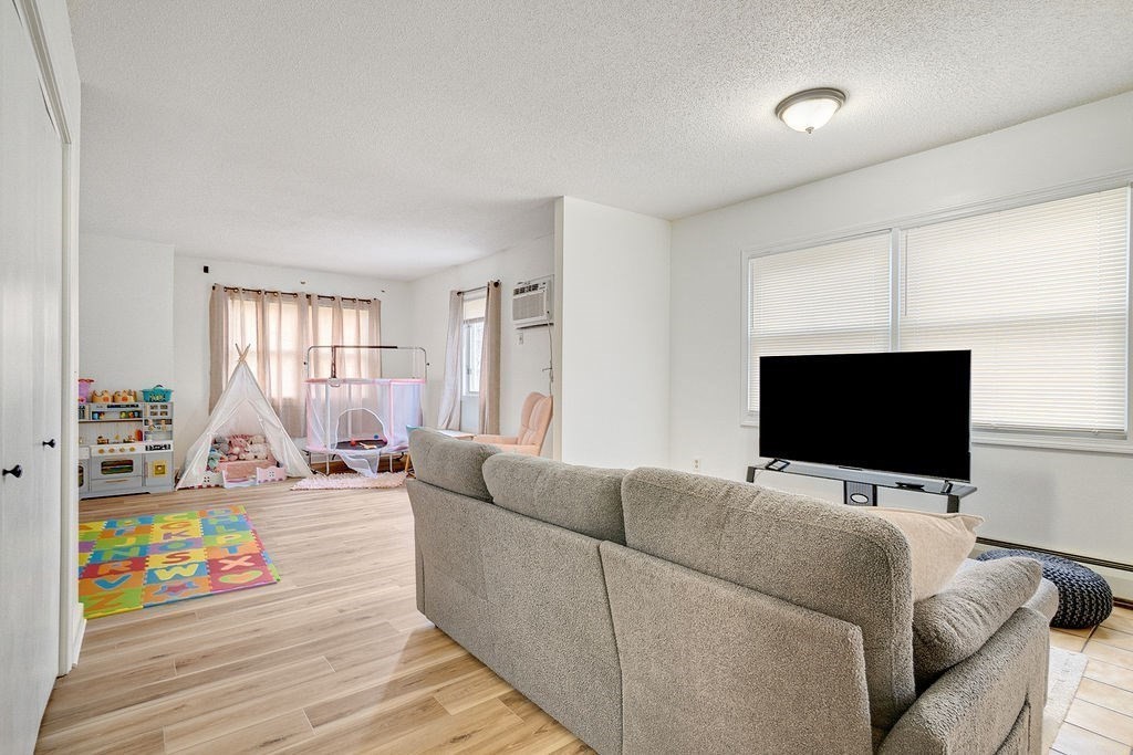 890-892 St James Avenue Springfield, MA 01104 - Photo 15 of 30 a living room with furniture and a flat screen tv