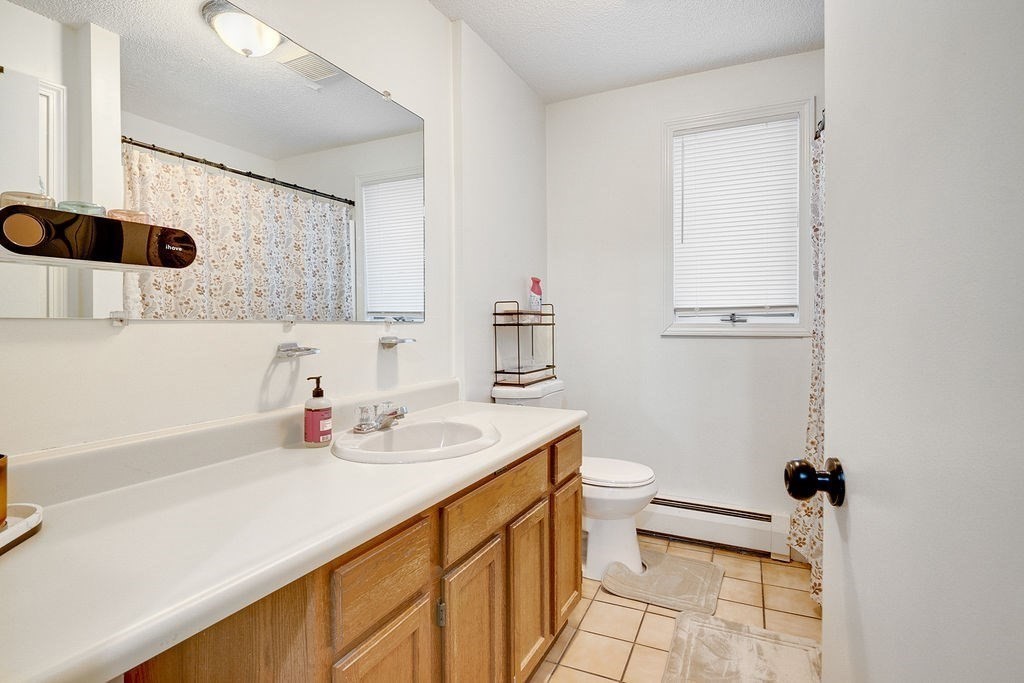 890-892 St James Avenue Springfield, MA 01104 - Photo 21 of 30 a bathroom with a sink and a mirror