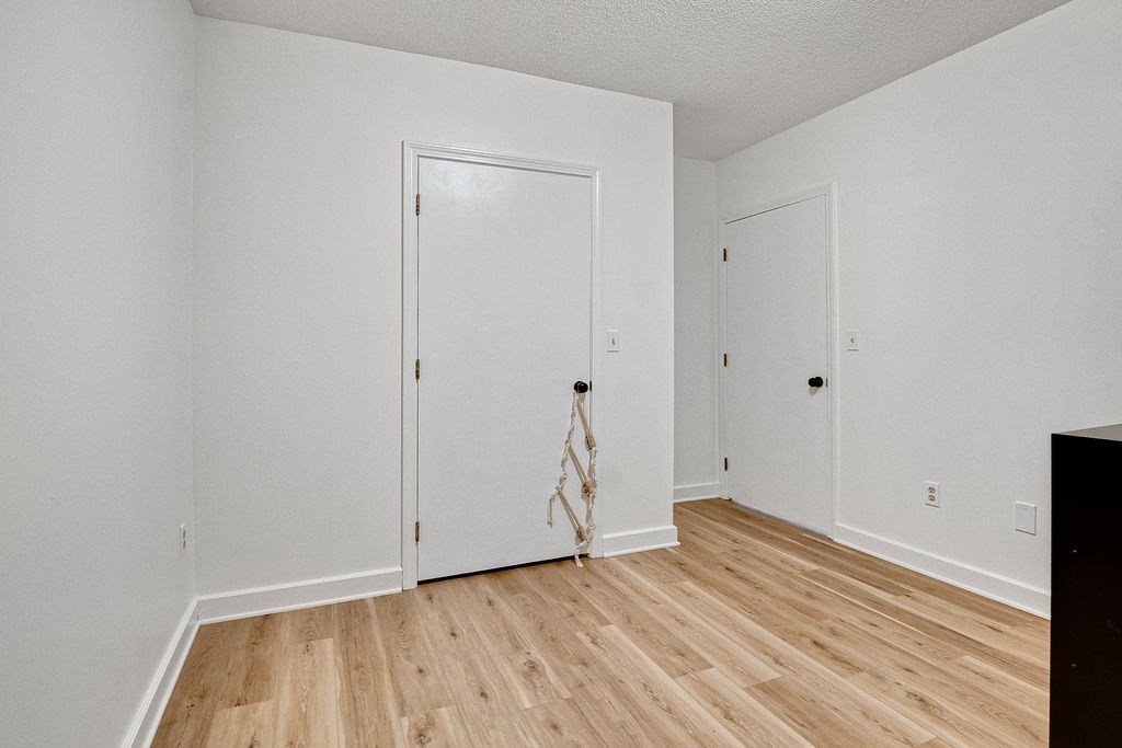 890-892 St James Avenue Springfield, MA 01104 - Photo 22 of 30 a view of an empty room with wooden floor
