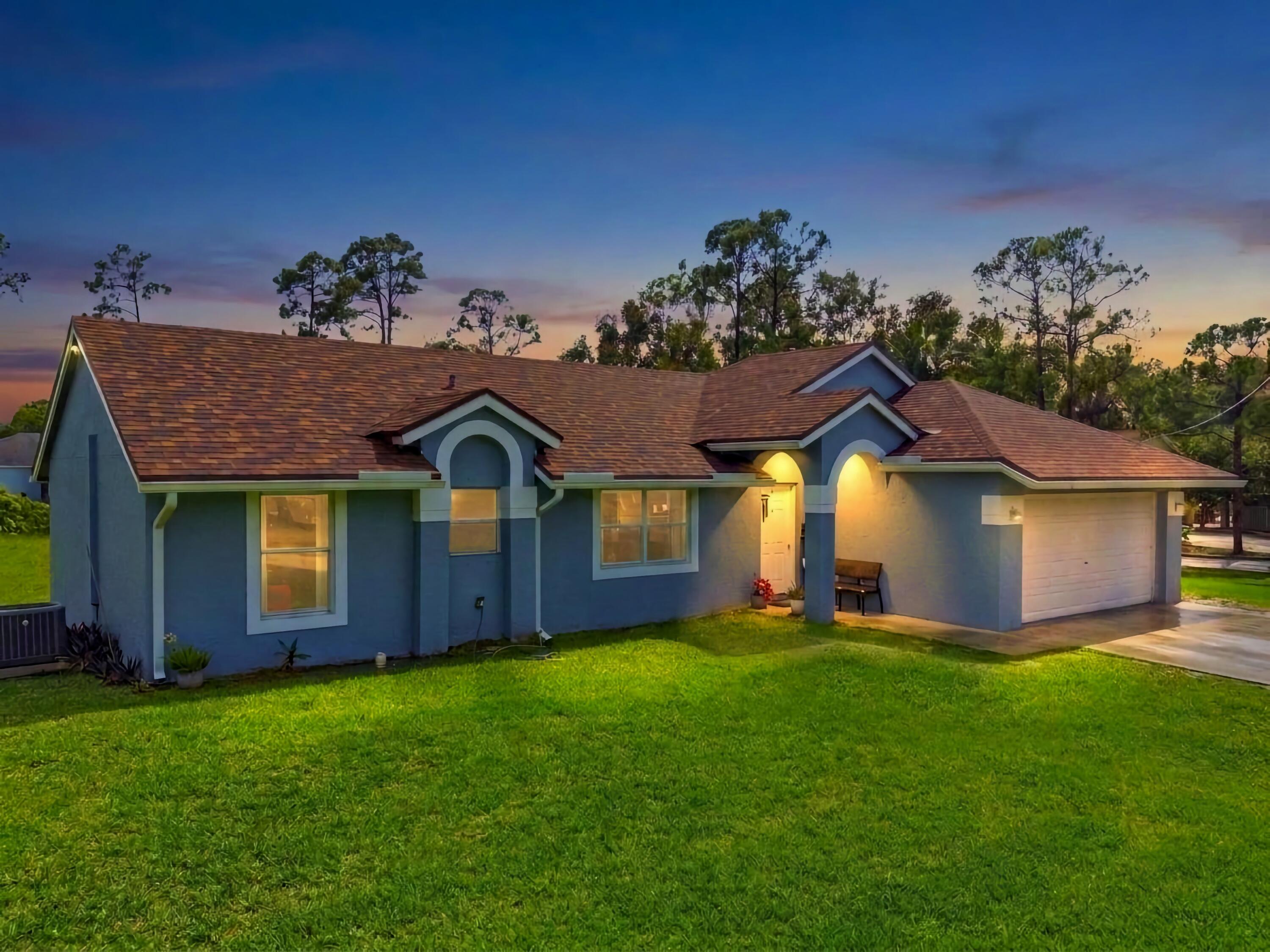 17770 93rd Road North The Acreage, FL 33470 - Photo 2 of 27 Front Dusk