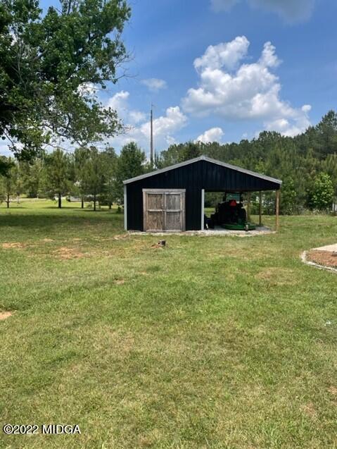 816 Lee King Road Forsyth, GA 31029 - Photo 11 of 15 a view of a house with a yard