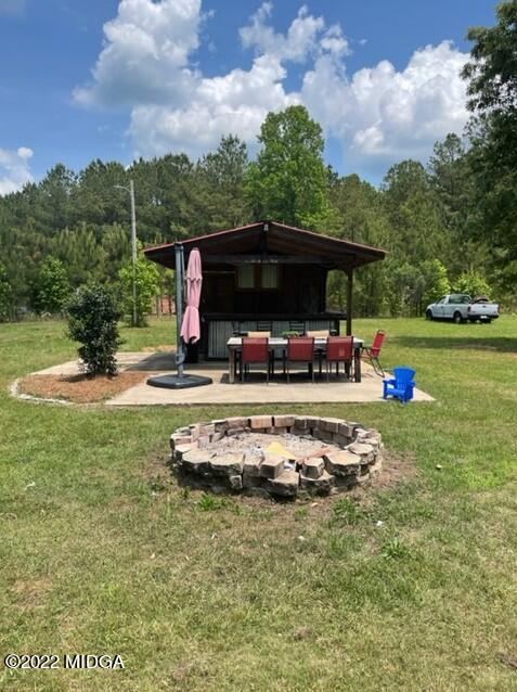 816 Lee King Road Forsyth, GA 31029 - Photo 12 of 15 a small garden covered with tall trees