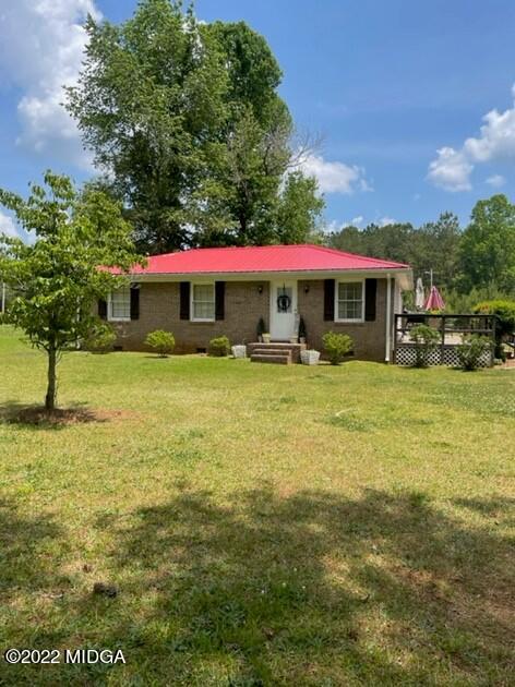 816 Lee King Road Forsyth, GA 31029 - Photo 2 of 15 a front view of house with yard