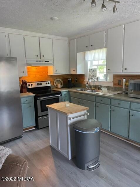 816 Lee King Road Forsyth, GA 31029 - Photo 8 of 15 a kitchen with a sink and a stove
