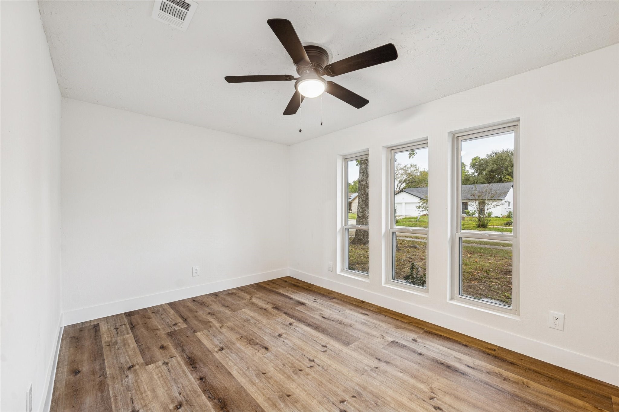 3623 Acorn Way Lane Spring, TX 77389 - Photo 14 of 25 wooden floor in an empty room with a window
