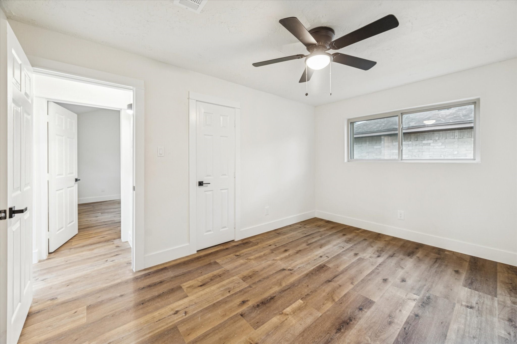 3623 Acorn Way Lane Spring, TX 77389 - Photo 19 of 25 an empty room with wooden floor and a ceiling fan
