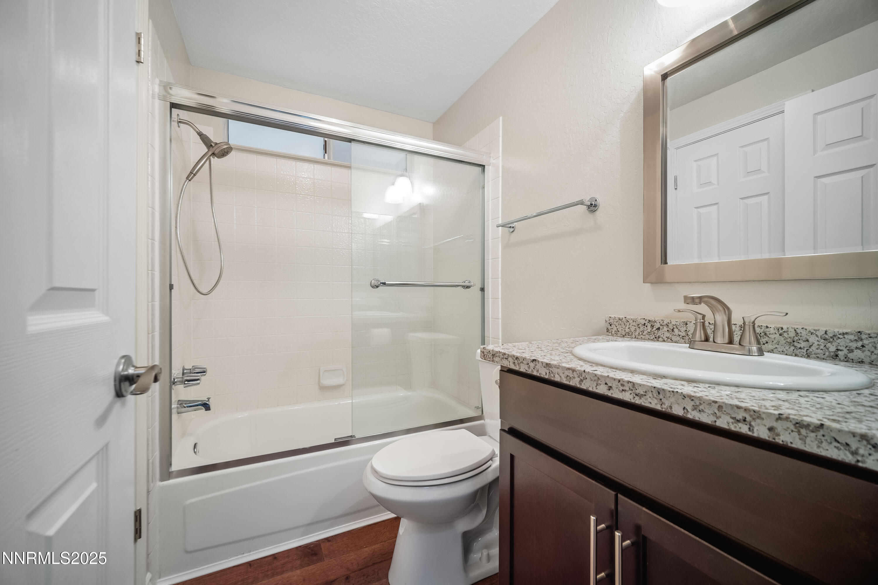 1146 Ambassador Drive Reno, NV 89523 - Photo 15 of 23 a bathroom with a granite countertop sink toilet and shower