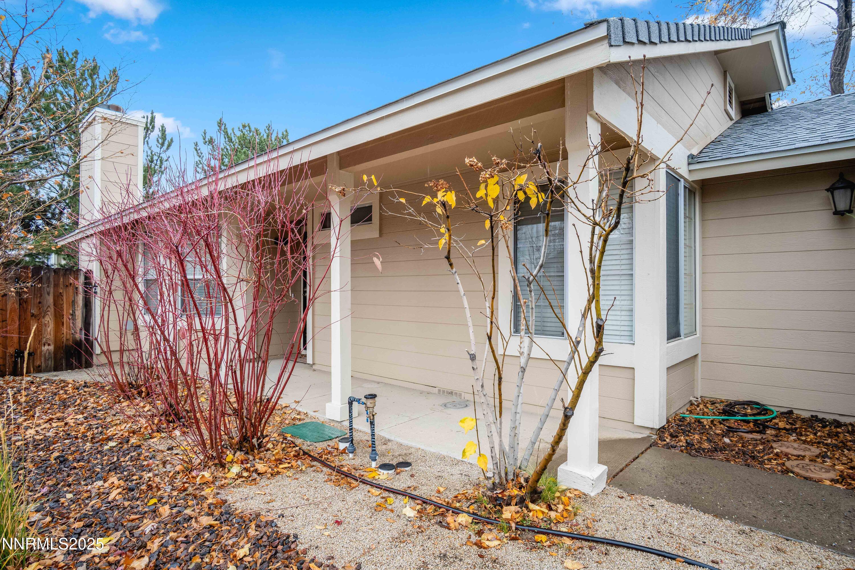 1146 Ambassador Drive Reno, NV 89523 - Photo 17 of 23 a side view of a house with a yard