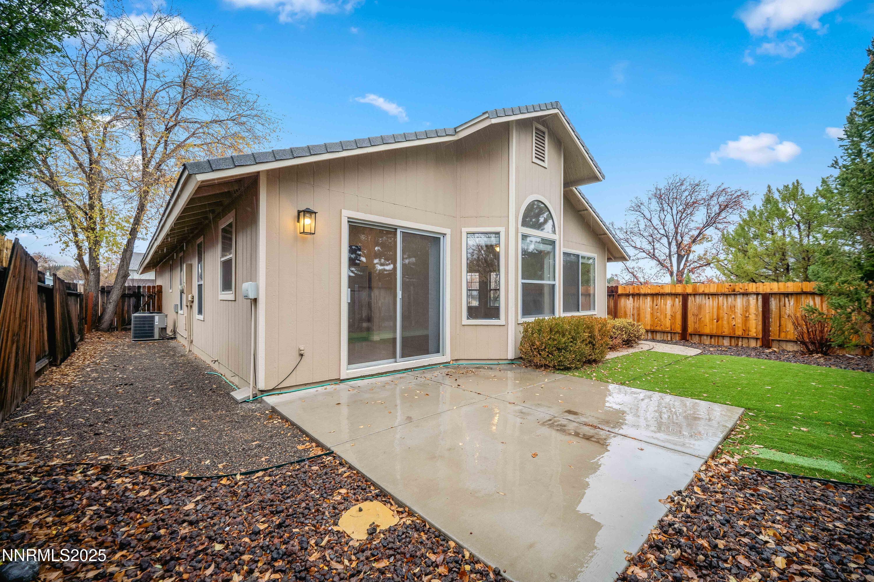 1146 Ambassador Drive Reno, NV 89523 - Photo 19 of 23 a front view of a house with a yard and trees