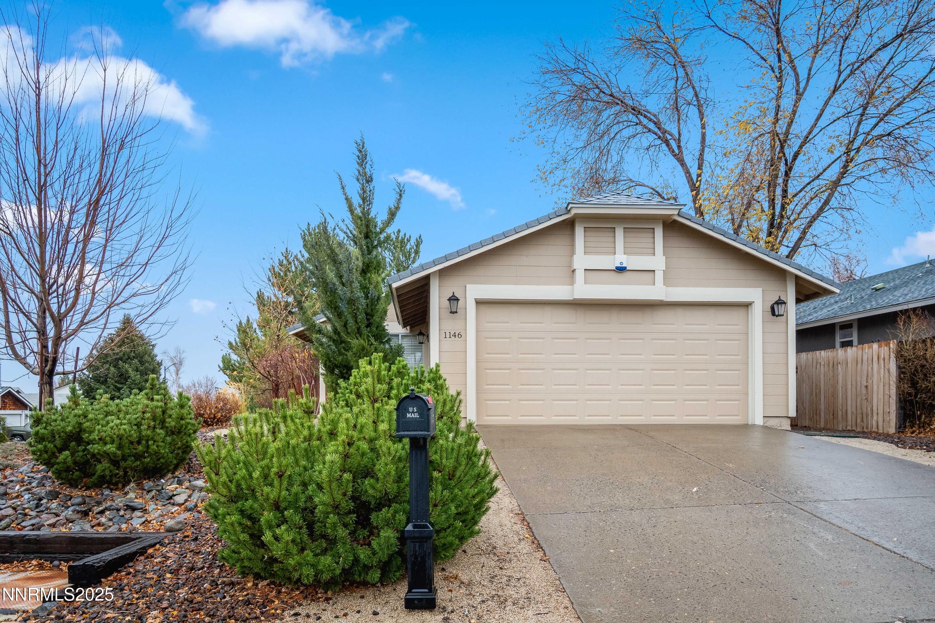 1146 Ambassador Drive Reno, NV 89523 - Photo 23 of 23 a front view of a house with a yard and garage
