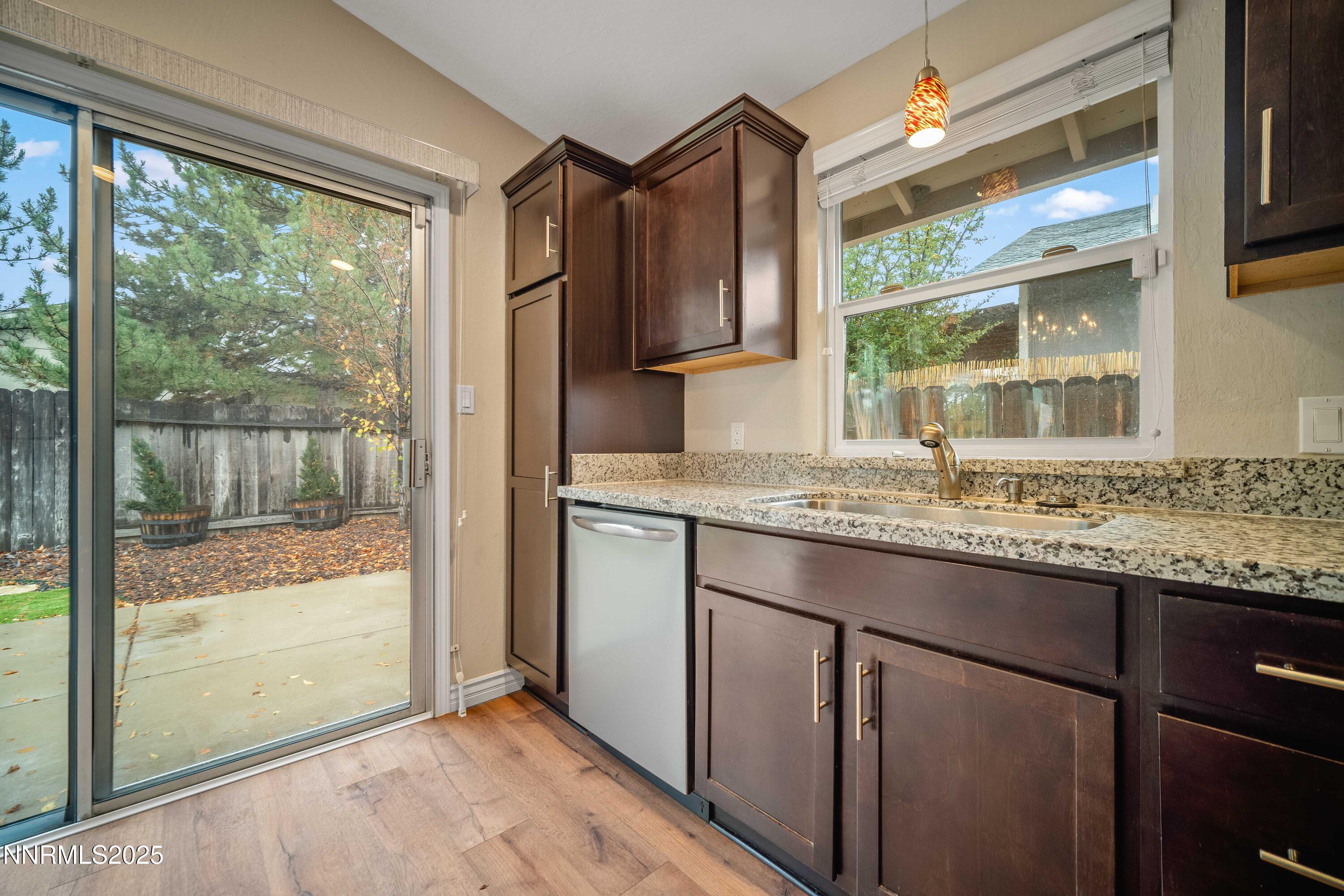 1146 Ambassador Drive Reno, NV 89523 - Photo 6 of 23 a bathroom with a granite countertop sink and a large mirror