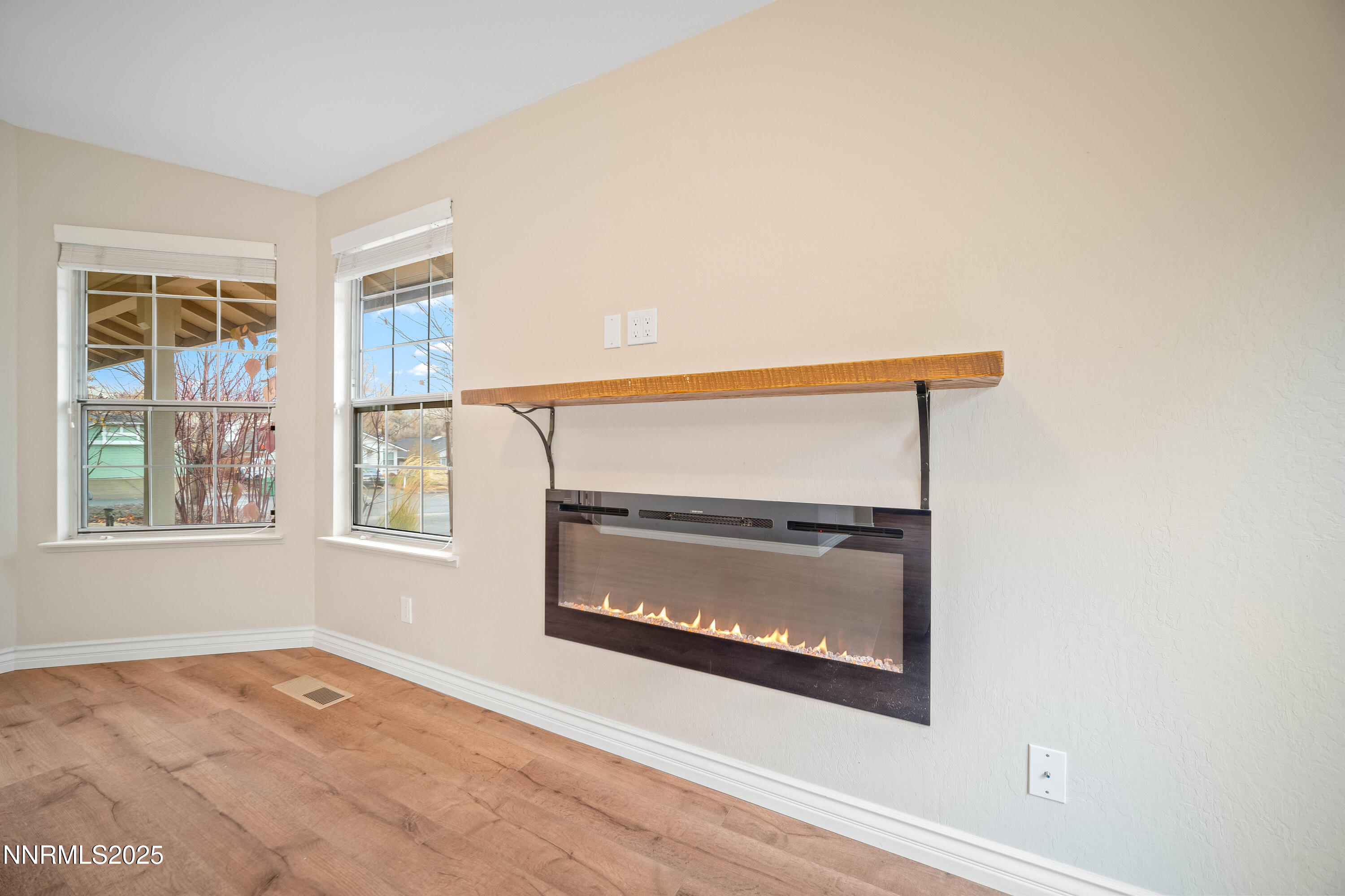 1146 Ambassador Drive Reno, NV 89523 - Photo 8 of 23 a view of an empty room with a window and a fireplace