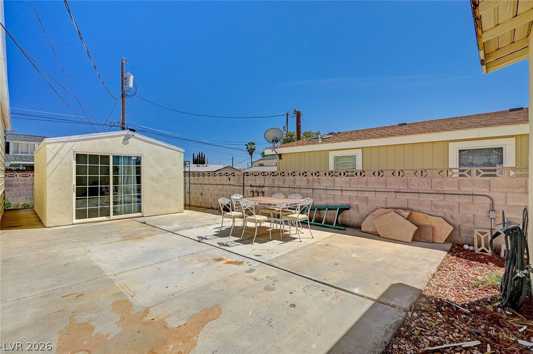 629 L Avenue Boulder City, NV 89005 - Photo 39 of 46 Fenced backyard featuring a patio and outdoor dining space
