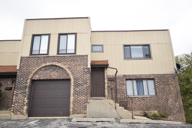 274 East Rimini Court, Unit 274 Palatine, IL 60067 - Photo 1 of 16 a front view of a house with a garage