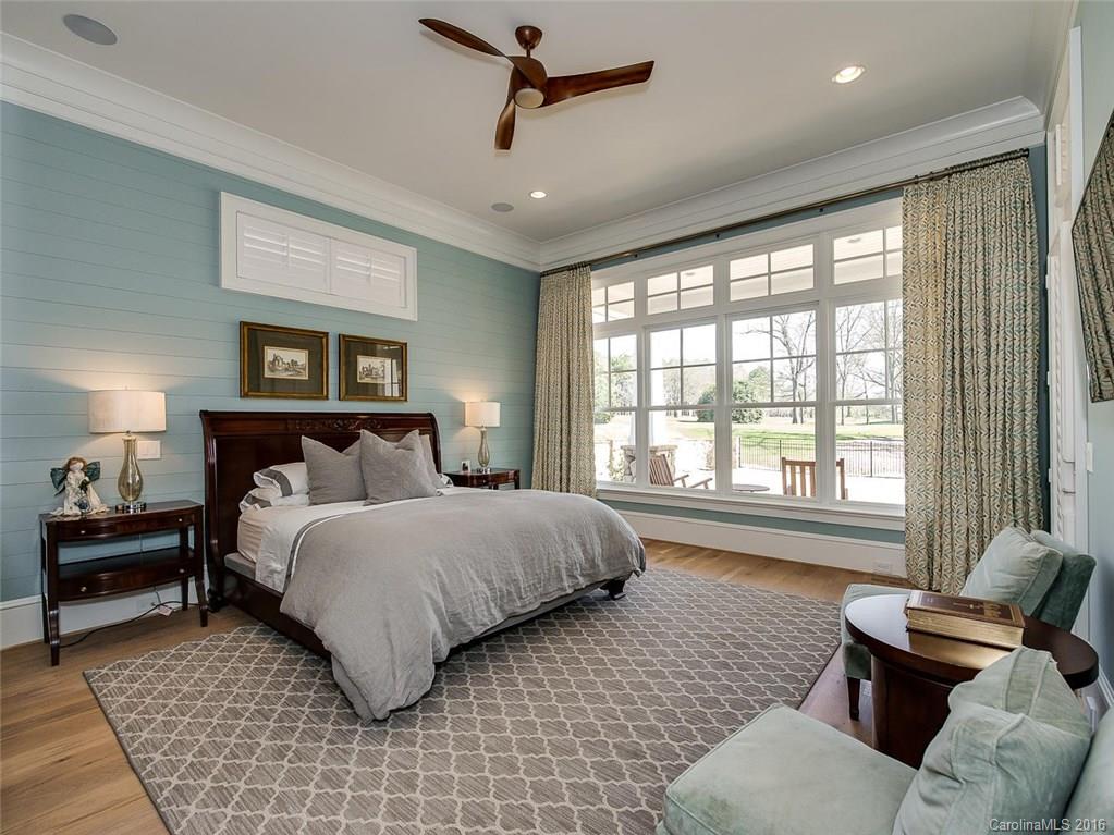 8405 Eagle Glen Charlotte, NC 28210 - Photo 11 of 24 a bedroom with a bed and wooden floor
