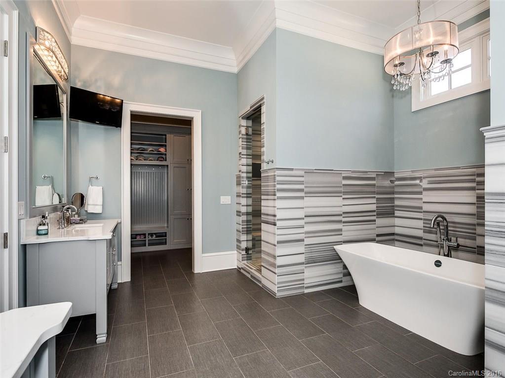 8405 Eagle Glen Charlotte, NC 28210 - Photo 12 of 24 a bathroom with a sink and a mirror