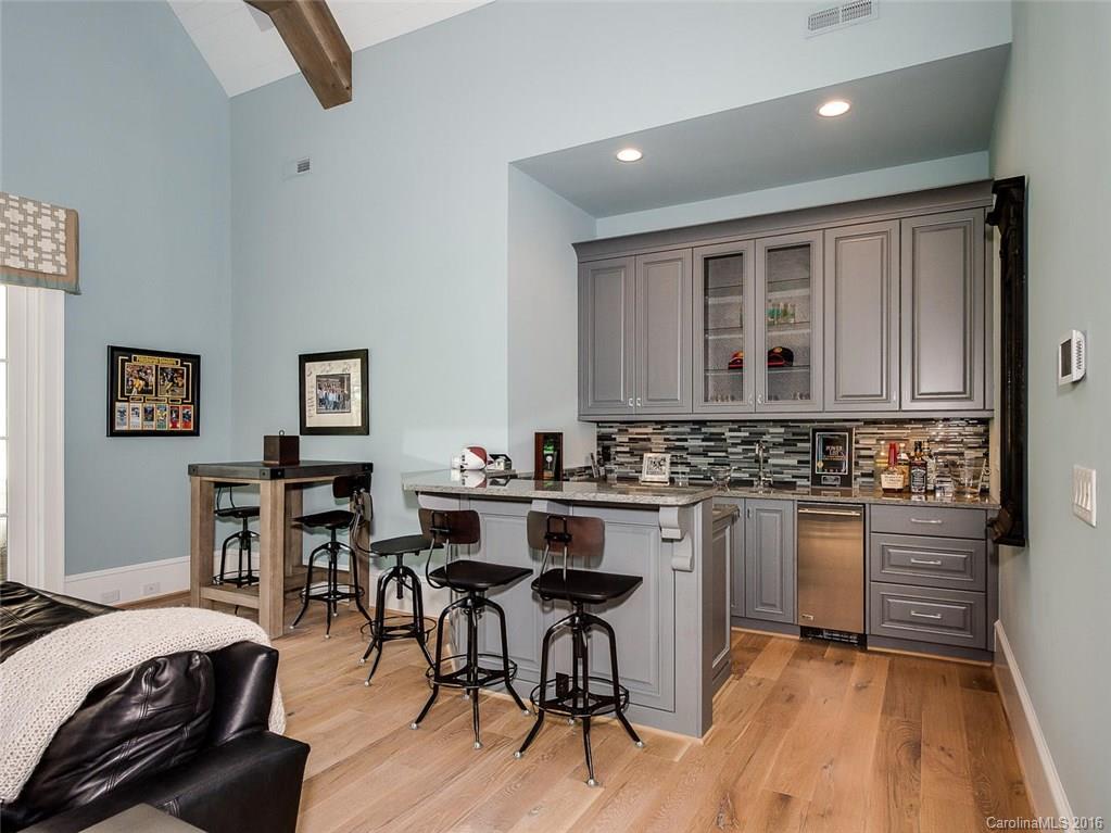 8405 Eagle Glen Charlotte, NC 28210 - Photo 14 of 24 a kitchen with a table and chairs in it