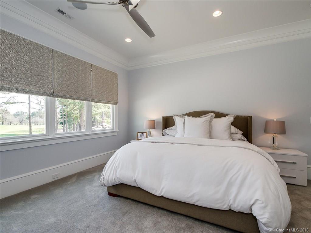 8405 Eagle Glen Charlotte, NC 28210 - Photo 17 of 24 a spacious bedroom with a bed and a window