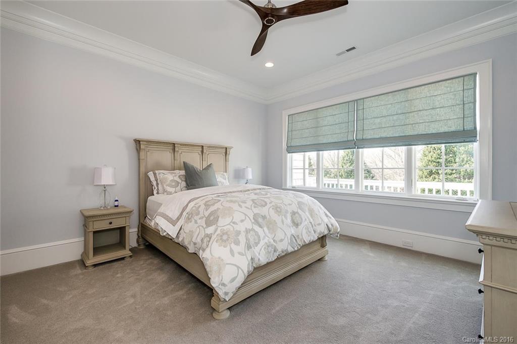 8405 Eagle Glen Charlotte, NC 28210 - Photo 19 of 24 a bed sitting in a room next to a window