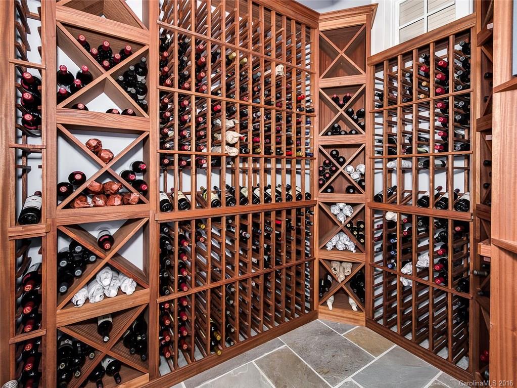 8405 Eagle Glen Charlotte, NC 28210 - Photo 4 of 24 a picture of a room with stairs and a wooden floor